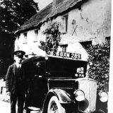 Postman outside Oak Ash and Thorn c1930s