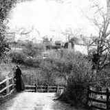 Lady in Black on the bridge to Mill Town