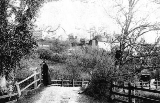 WEW3 Lady in Black on the bridge to Mill Town.jpg