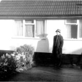 Little Dart Bungalow With Mrs Roy Troake in front of the building