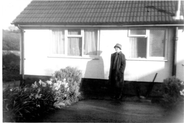 Little Dart Bungalow With Mrs Roy Troake in front of the building