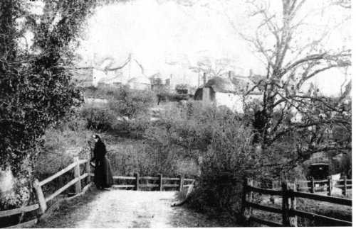 WEW3-Lady-in-Black-on-the-bridge-to-Mill-Town